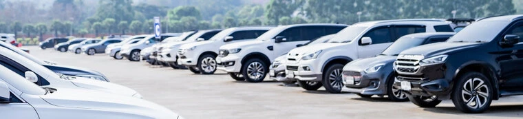 Line up of used cars Line of used cars and trucks on a car dealer's lot